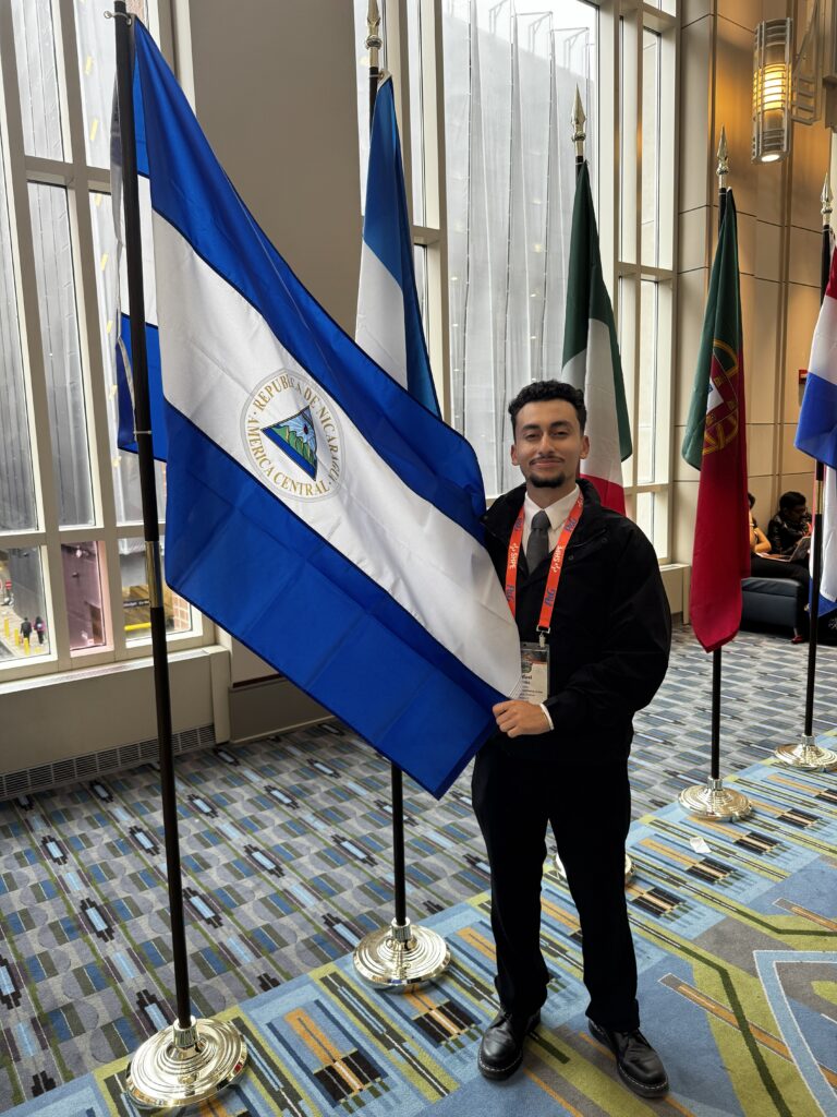 Perez is of Nicaraguan descent and proudly poses next to the flag of Nicaragua.