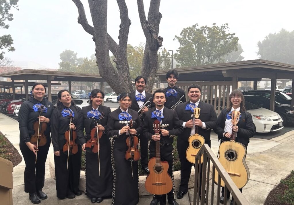 Pereze poses with Mariachi Orgullo de UCI.